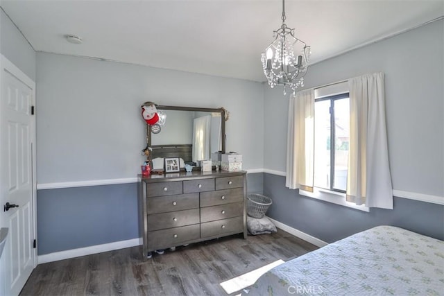 1853 E Renshaw St, Covina, CA 91724 - bedroom with wood finished floors and a chandelier