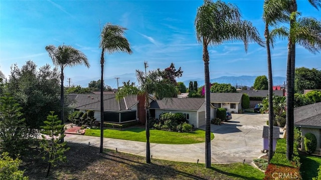 1853 E Renshaw St, Covina, CA 91724 - view of front of house featuring concrete driveway and a front yard
