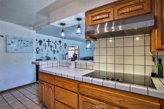 1853 E Renshaw St, Covina, CA 91724 - kitchen with range hood, brown cabinets, decorative backsplash, black electric cooktop, and light tile patterned flooring