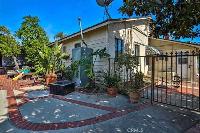 1853 E Renshaw St, Covina, CA 91724 - view of property exterior with a patio area and a gate