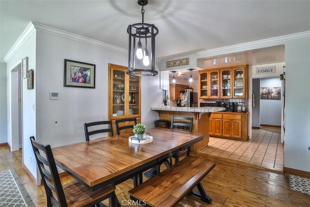 1853 E Renshaw St, Covina, CA 91724 - dining room featuring crown molding and light wood-style floors