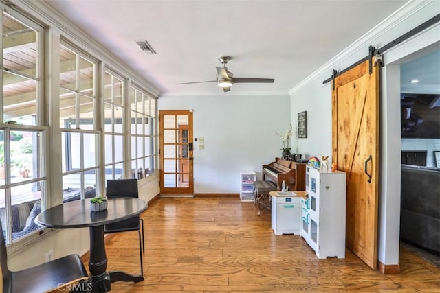 1853 E Renshaw St, Covina, CA 91724 - interior space with wood finished floors, crown molding, ceiling fan, a barn door, and french doors
