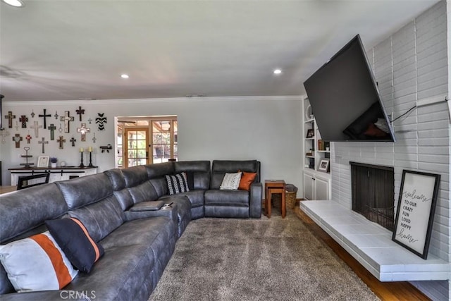 1853 E Renshaw St, Covina, CA 91724 - living area with ornamental molding, recessed lighting, a fireplace, wood finished floors, and built in shelves