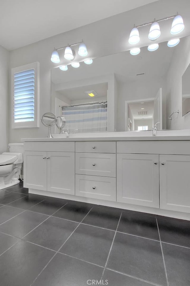 25 Sedgewick, Irvine, CA 92620 - bathroom with double vanity, tile patterned floors, and a shower with curtain