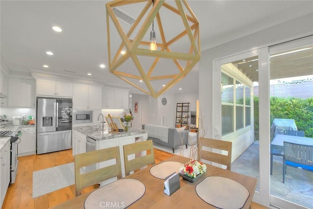 25 Sedgewick, Irvine, CA 92620 - dining space with recessed lighting, light wood-type flooring, and ornamental molding
