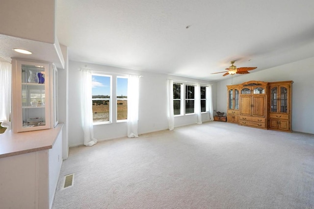 36748 Parrot Mountain Rd, Ranchita, CA 92066 - unfurnished living room with light carpet and a ceiling fan