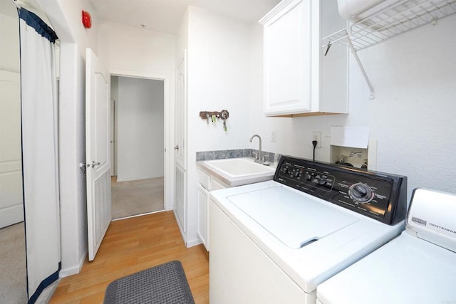 36748 Parrot Mountain Rd, Ranchita, CA 92066 - laundry room with washing machine and clothes dryer, light wood finished floors, and cabinet space