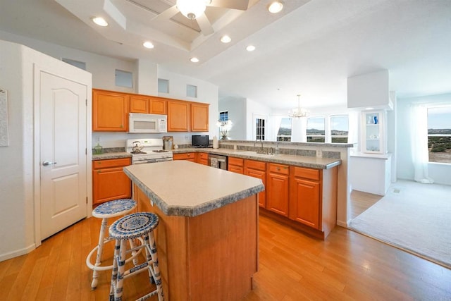 36748 Parrot Mountain Rd, Ranchita, CA 92066 - kitchen featuring white appliances, a center island, recessed lighting, a peninsula, and light wood finished floors