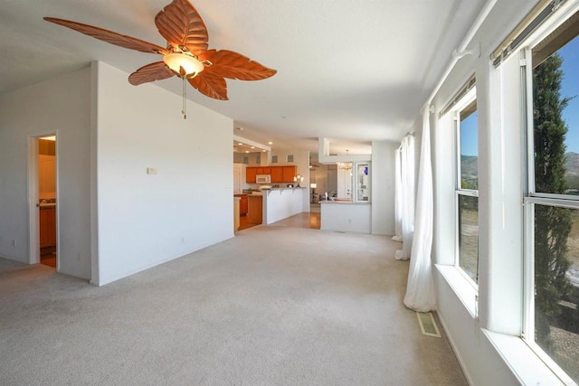 36748 Parrot Mountain Rd, Ranchita, CA 92066 - unfurnished living room with light carpet and ceiling fan