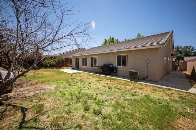 3309 Kaylyn St, Lancaster, CA 93535 - rear view of house with a patio area, stucco siding, and a fenced backyard