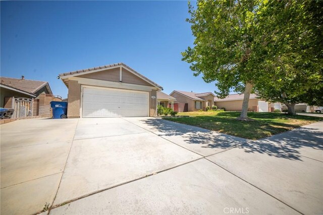 3309 Kaylyn St, Lancaster, CA 93535 - single story home with driveway, a garage, a front yard, and stucco siding