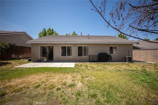 3309 Kaylyn St, Lancaster, CA 93535 - back of property with stucco siding and a patio