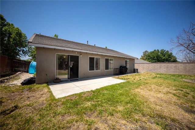 3309 Kaylyn St, Lancaster, CA 93535 - back of house featuring a fenced backyard, a patio, and stucco siding