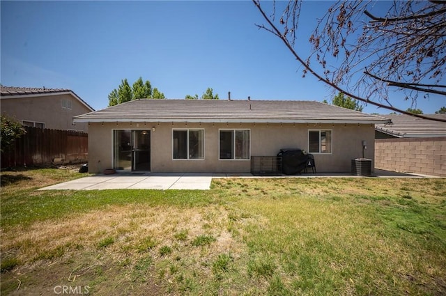3309 Kaylyn St, Lancaster, CA 93535 - rear view of property featuring stucco siding and a patio area