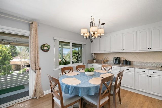 856 Ronda Mendoza Unit P, Laguna Woods, CA 92637 - dining area featuring a chandelier and light wood-style floors
