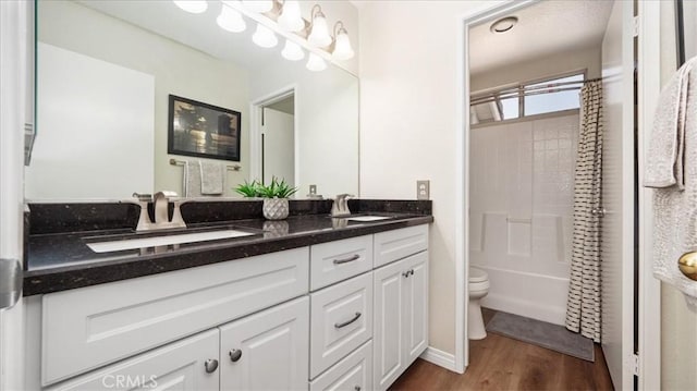 7192 Carano Pl, Rancho Cucamonga, CA 91701 - bathroom with double vanity, wood finished floors, and shower / washtub combination