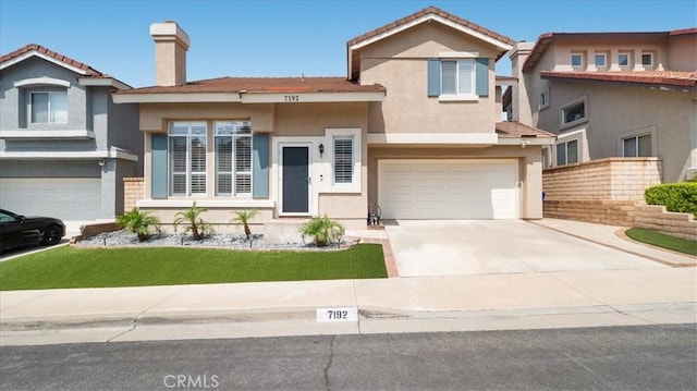7192 Carano Pl, Rancho Cucamonga, CA 91701 - split level home with stucco siding, an attached garage, concrete driveway, and a front yard