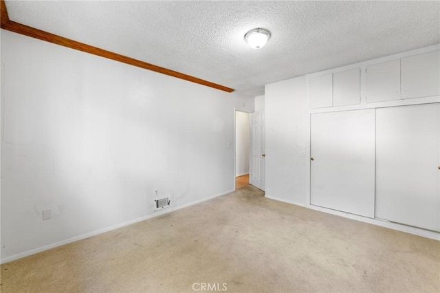 25286 N Rd, Twin Peaks, CA 92391 - unfurnished bedroom featuring a textured ceiling, carpet, and a closet