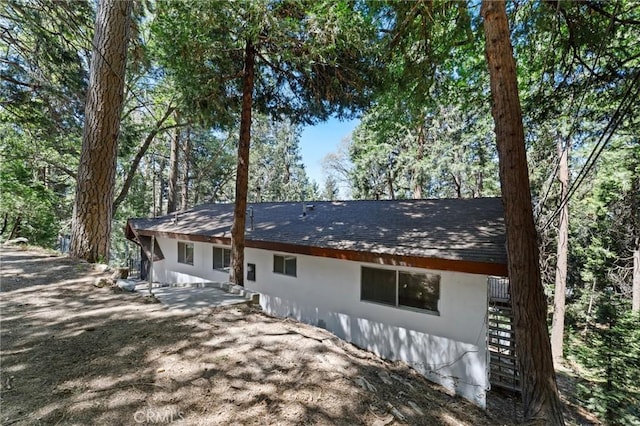 25286 N Rd, Twin Peaks, CA 92391 - view of front facade featuring stucco siding, a shingled roof, and a patio