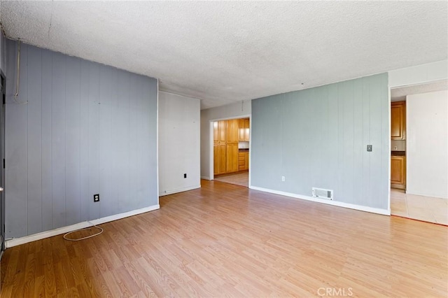 25286 N Rd, Twin Peaks, CA 92391 - empty room with light wood-style floors and a textured ceiling