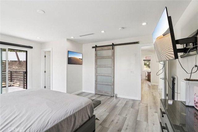 11911 Louise Ave, Granada Hills, CA 91344 - bedroom with multiple windows, a barn door, light wood-type flooring, access to outside, and recessed lighting