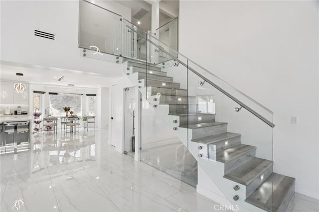 11911 Louise Ave, Granada Hills, CA 91344 - staircase with marble tiled flooring and a towering ceiling