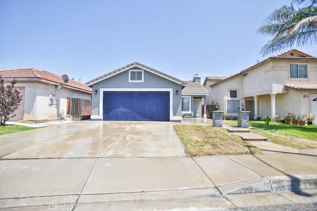 1385 Orange Grove Ave, Colton, CA 92324 - single story home featuring stucco siding, an attached garage, driveway, and a tile roof