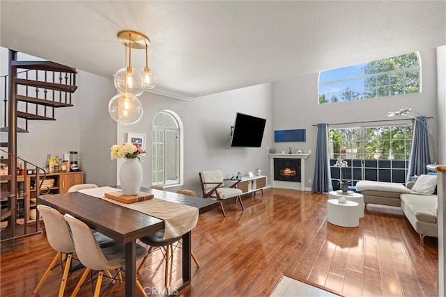 4211 Arch Dr Unit 201, Studio City, CA 91604 - dining area with wood finished floors, stairs, and a warm lit fireplace