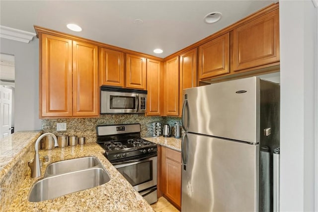 4211 Arch Dr Unit 201, Studio City, CA 91604 - kitchen with stainless steel appliances, light stone counters, decorative backsplash, recessed lighting, and brown cabinets