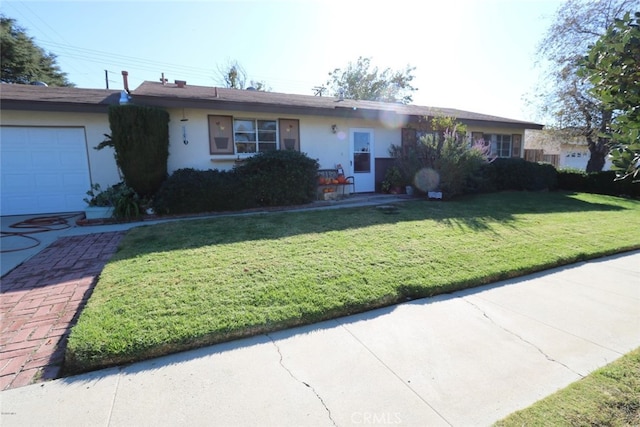 1890 Hamilton St, Simi Valley, CA 93065 - ranch-style house featuring stucco siding, a garage, and a front lawn