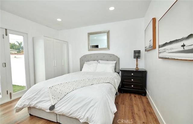 728 Euclid St, Santa Monica, CA 90402 - bedroom featuring wood finished floors, recessed lighting, and a closet