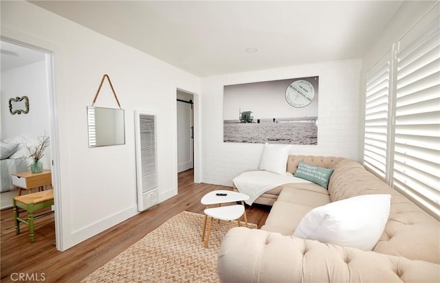 728 Euclid St, Santa Monica, CA 90402 - living room featuring a heating unit and wood finished floors