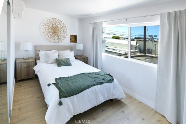 728 Euclid St, Santa Monica, CA 90402 - bedroom with wood finished floors and an AC wall unit