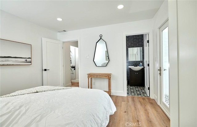 728 Euclid St, Santa Monica, CA 90402 - bedroom featuring light wood finished floors, multiple windows, ensuite bathroom, and recessed lighting