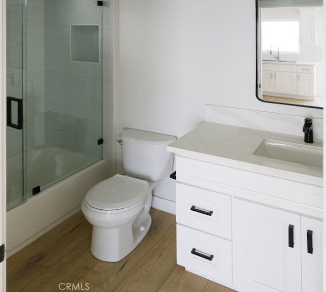 728 Euclid St, Santa Monica, CA 90402 - bathroom with vanity, wood finished floors, and enclosed tub / shower combo