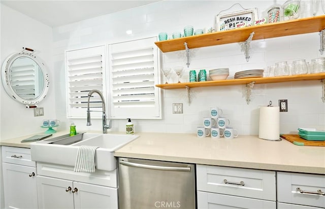 728 Euclid St, Santa Monica, CA 90402 - kitchen featuring stainless steel dishwasher, open shelves, light countertops, and white cabinetry