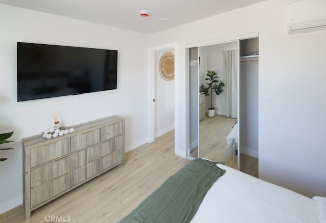 728 Euclid St, Santa Monica, CA 90402 - bedroom featuring a wall mounted AC, light wood-type flooring, and a closet