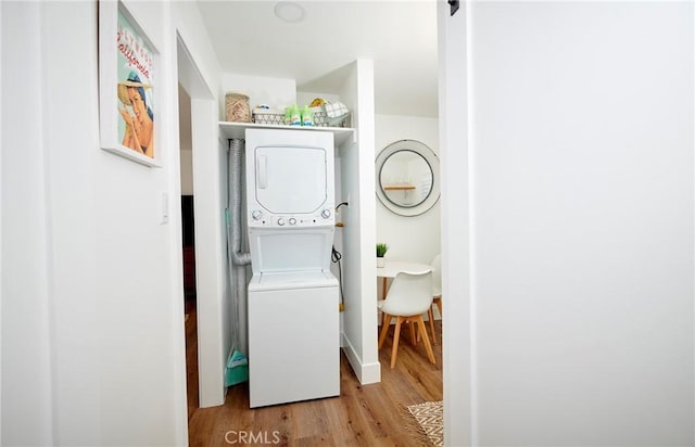 728 Euclid St, Santa Monica, CA 90402 - laundry area with stacked washer / dryer and light wood-type flooring