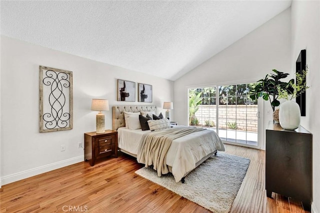 3401 Mountainside Cir, Corona, CA 92882 - bedroom with access to outside, a textured ceiling, light wood-style flooring, and high vaulted ceiling