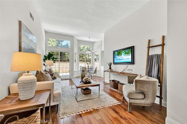 3401 Mountainside Cir, Corona, CA 92882 - living area with wood finished floors and a textured ceiling