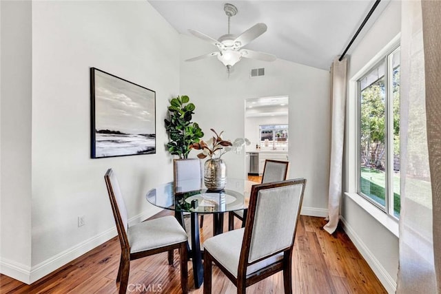 3401 Mountainside Cir, Corona, CA 92882 - dining room with vaulted ceiling, wood finished floors, and ceiling fan
