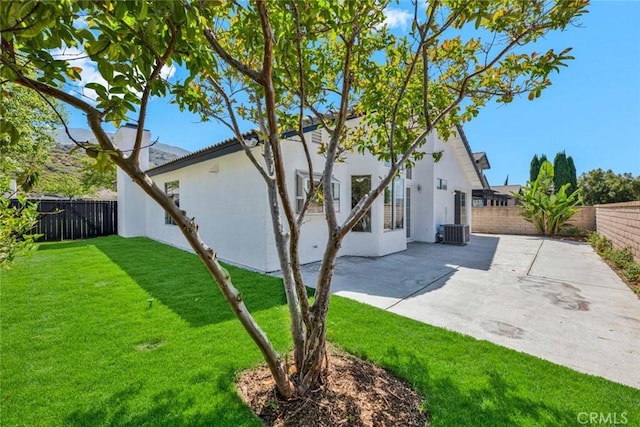 3401 Mountainside Cir, Corona, CA 92882 - rear view of property featuring a patio area, stucco siding, and a fenced backyard