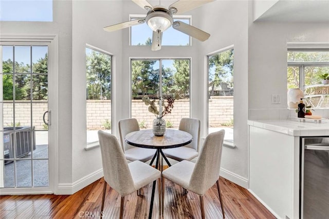 3401 Mountainside Cir, Corona, CA 92882 - dining space with ceiling fan, light wood-type flooring, and plenty of natural light
