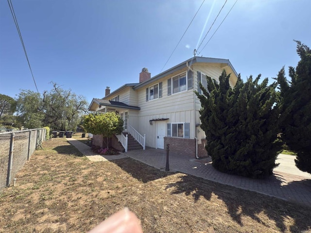 311 Corto, Solana Beach, CA 92075 - view of side of home with a chimney and brick siding
