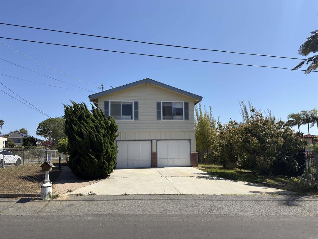 311 Corto, Solana Beach, CA 92075 - view of front of house featuring driveway and an attached garage