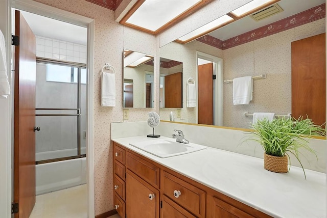 311 Corto, Solana Beach, CA 92075 - full bathroom featuring vanity, wallpapered walls, and shower / bath combination with glass door
