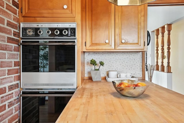 311 Corto, Solana Beach, CA 92075 - kitchen featuring butcher block countertops and brick wall