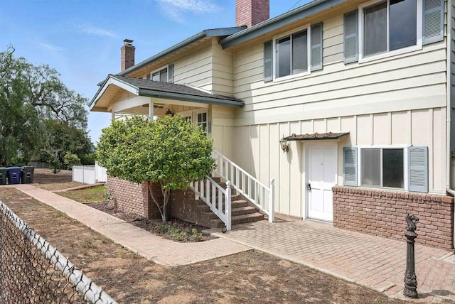 311 Corto, Solana Beach, CA 92075 - rear view of property with a chimney, stairway, and board and batten siding