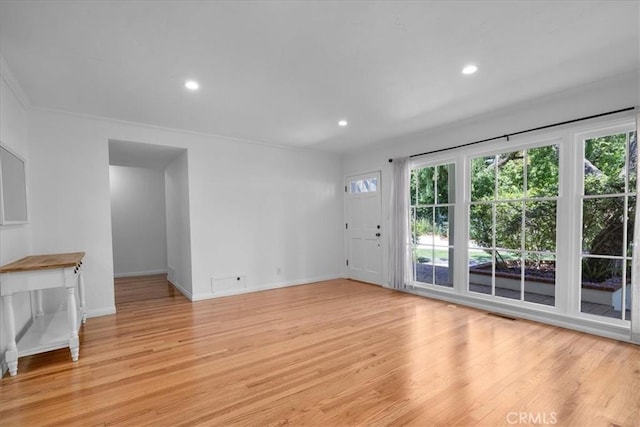 11 Dapplegray Ln, Rolling Hills Estates, CA 90274 - unfurnished living room featuring light wood-type flooring, plenty of natural light, recessed lighting, and crown molding
