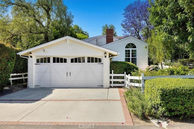 11 Dapplegray Ln, Rolling Hills Estates, CA 90274 - view of front of home featuring stucco siding, a chimney, and a garage